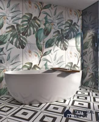 Freestanding bathtub against a botanical tile wall with geometric black and white floor